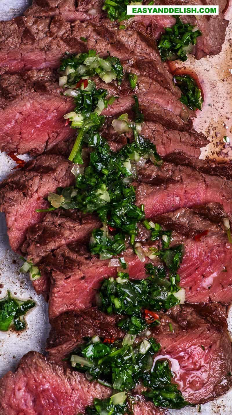 close up of carne asada with chimichurri sauce