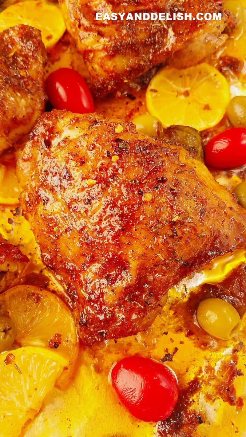 close up of baked bone in chicken thighs in a sheet pan