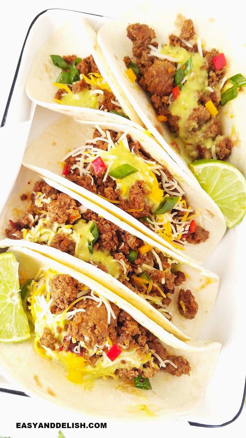 close up showing several tacos ina bowl made with Instant Pot ground beef