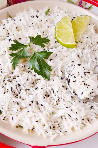 a bowl of basmati rice with garnishing on top