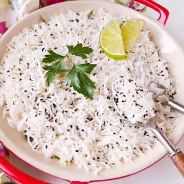 a bowl of basmati rice with garnishing on top