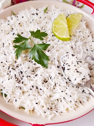 a bowl of basmati rice with garnishing on top