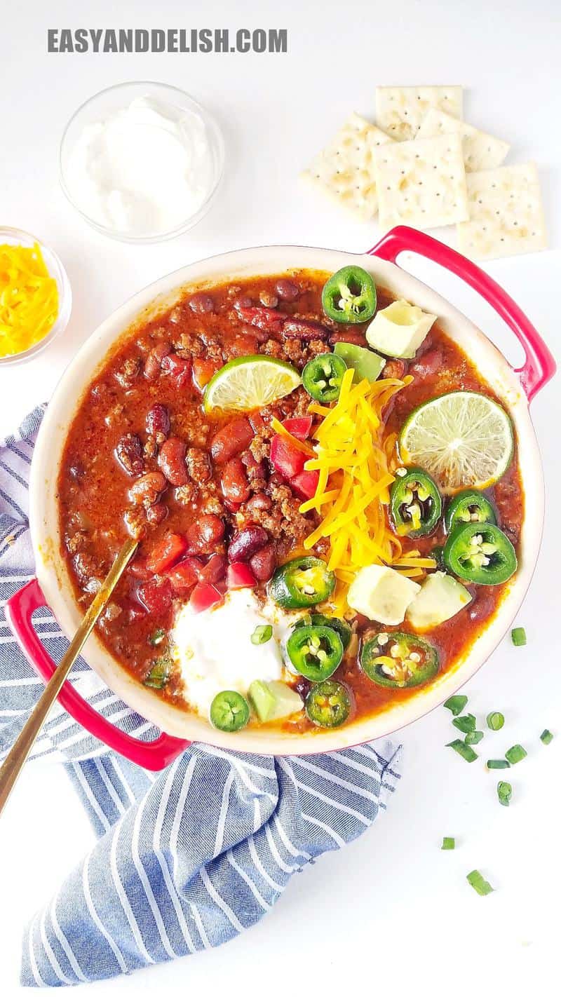 a bowl of the stew and garnishes around it