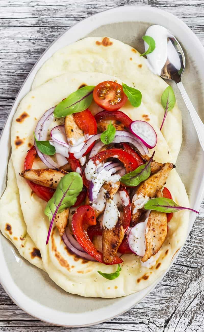 flat bread topped with chicken and veggies