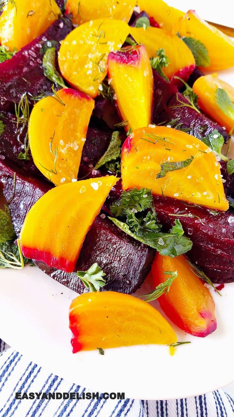 cooked veggies on a platter topped witha sprinkle of coarse salt