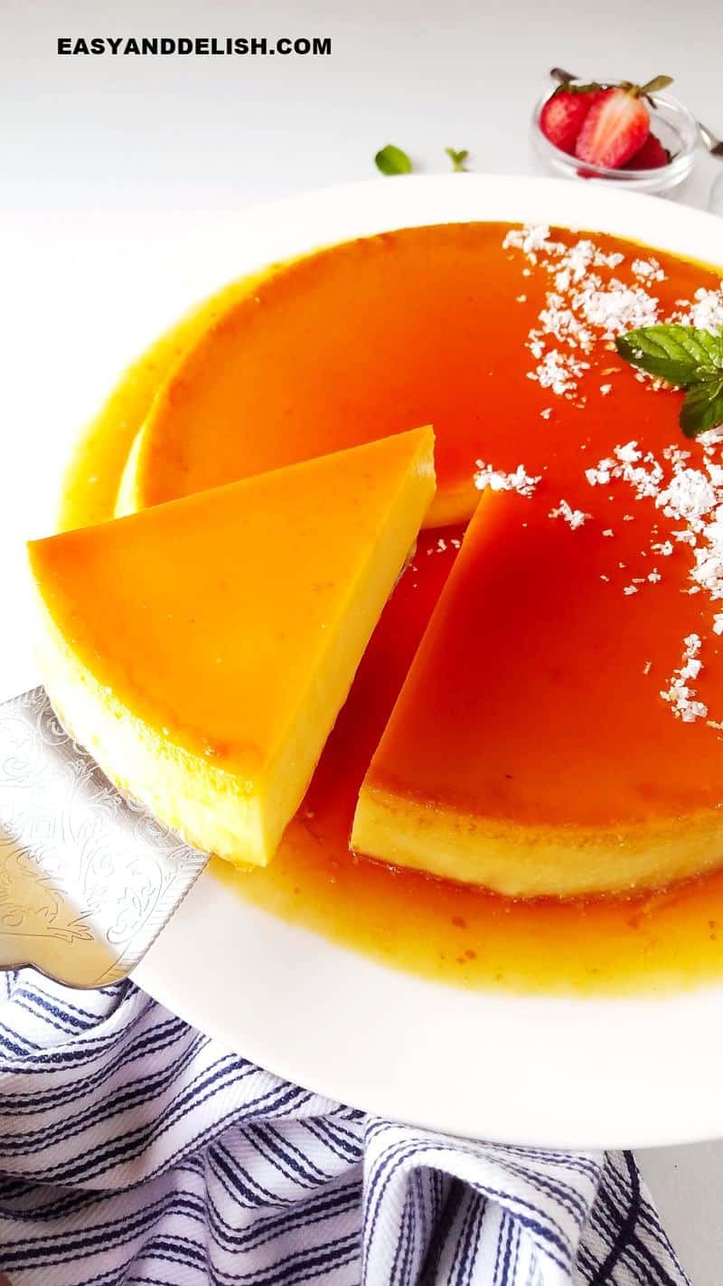 a slice of coconut flan being lifted