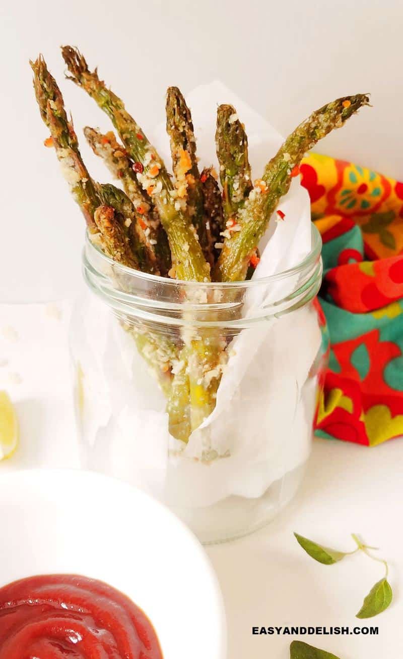 asparagus fries in a jar with sauce on the side