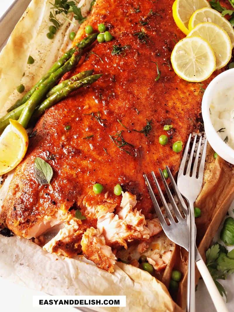 close up of baked blackened salmon flaked on the side