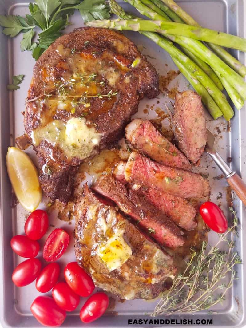 cooked beef and veggies in a baking sheet