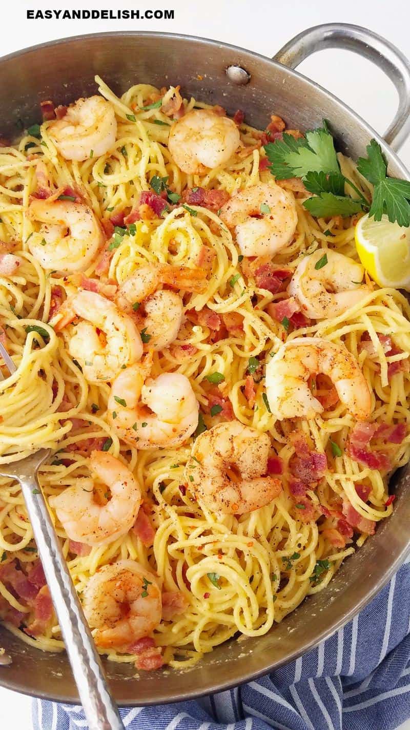 pan with shrimp carbonara and a fork