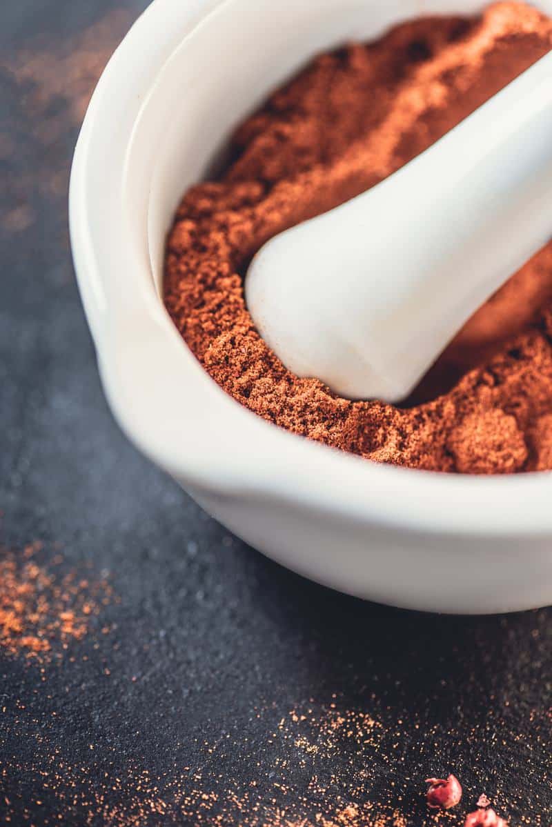 a mortar with keto taco seasoning