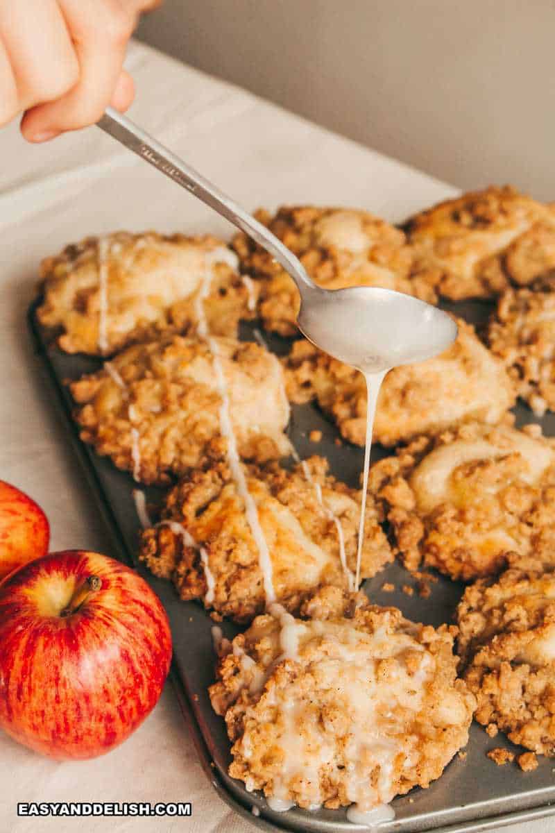 baked goodies in a tin drizzled with a glaze