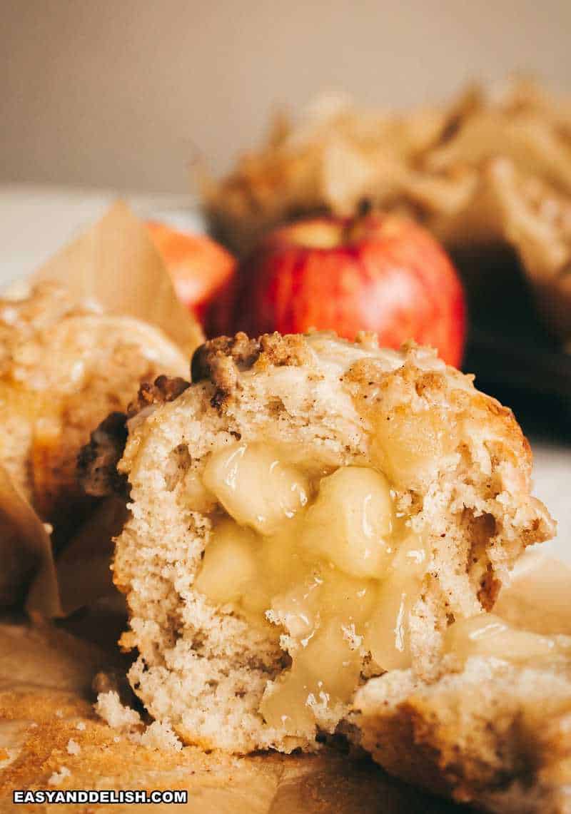apple crumb muffin cut in half showing teh apple pie filling