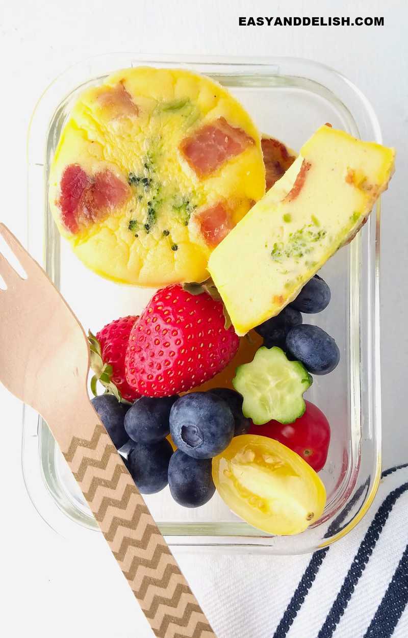 small lunch box with breakfast egg muffins and fruits