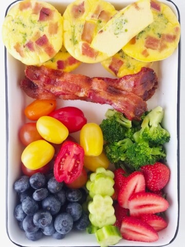 keto egg muffins with bacon, low carb veggies and fruits in a lunch box