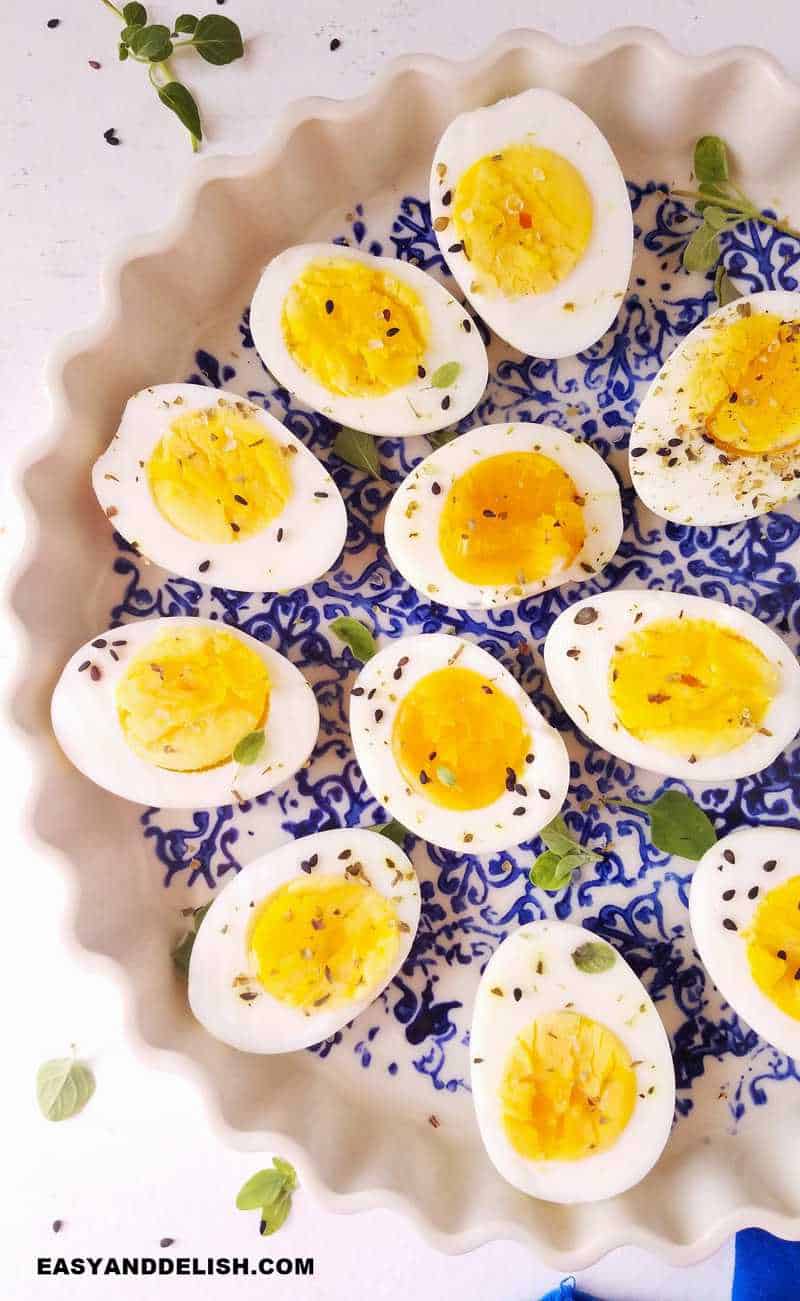 a plate with air fryer hard boiled eggs sliced in half