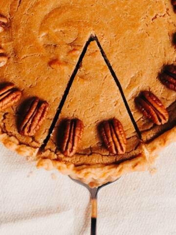 a slice being removed from butterscotch pie