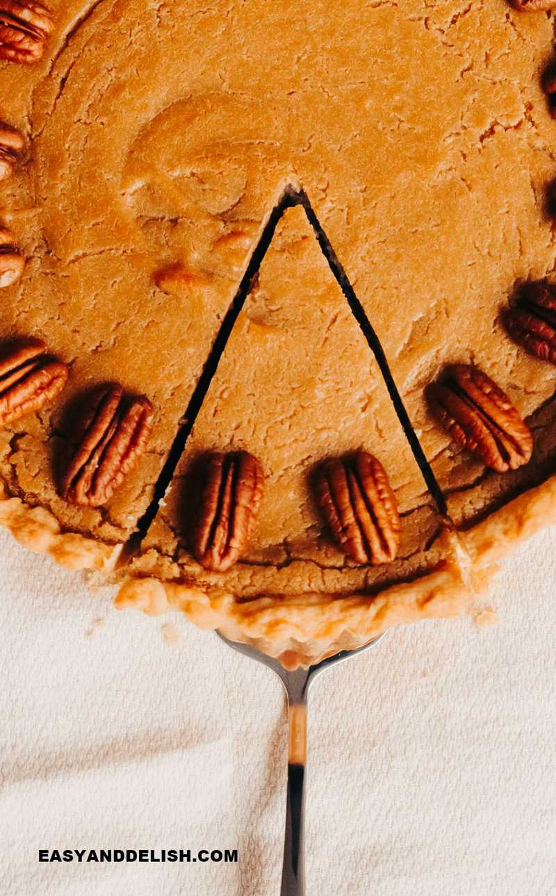 a slice being removed from butterscotch pie