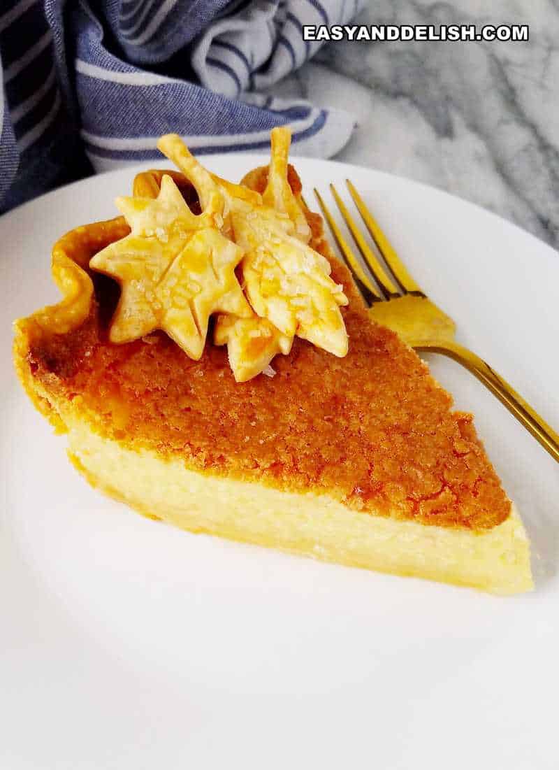 a slice of buttermilk pie with a fork on the side