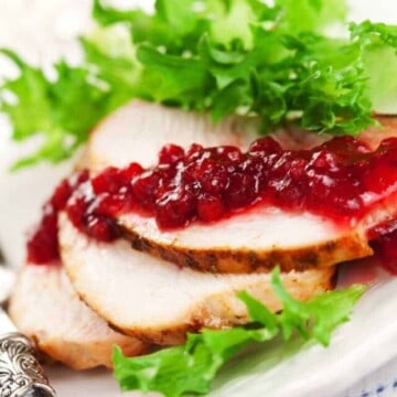 slices of turkey breast topped with cranberry sauce