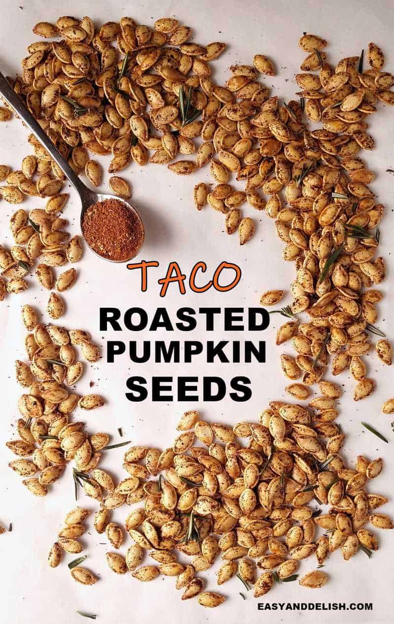 a bunch of roasted pumpkin seeds with a spoon of taco seasoning on the side