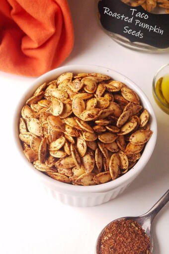 a bowl with roasted pumpkin seeds keto