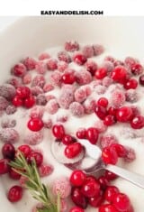 sugared cranberries close up in a bowl of sugar