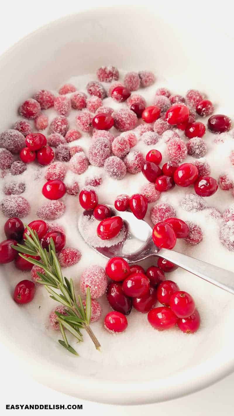 tossing berries in sugar