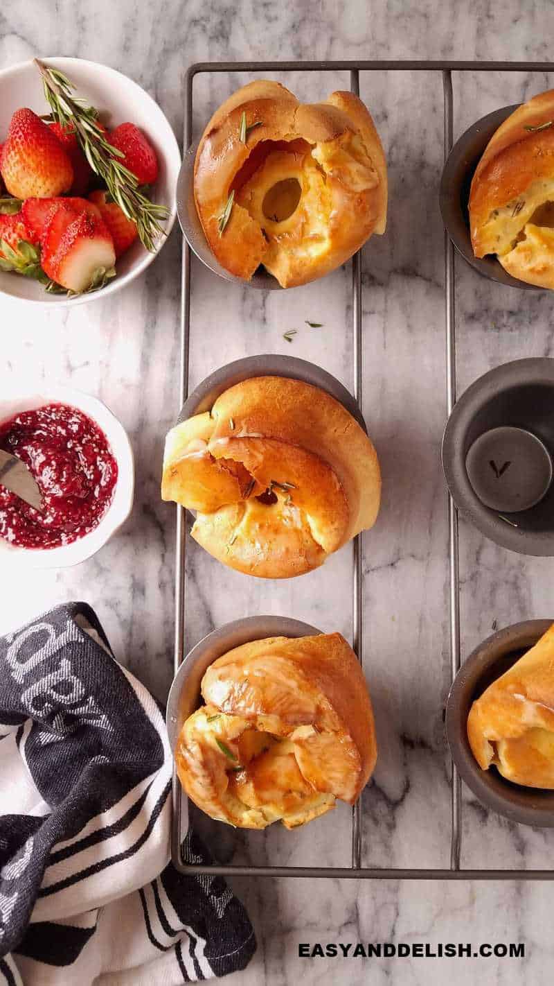 rolls served for breakfast in a tin with fruits and jam on the side