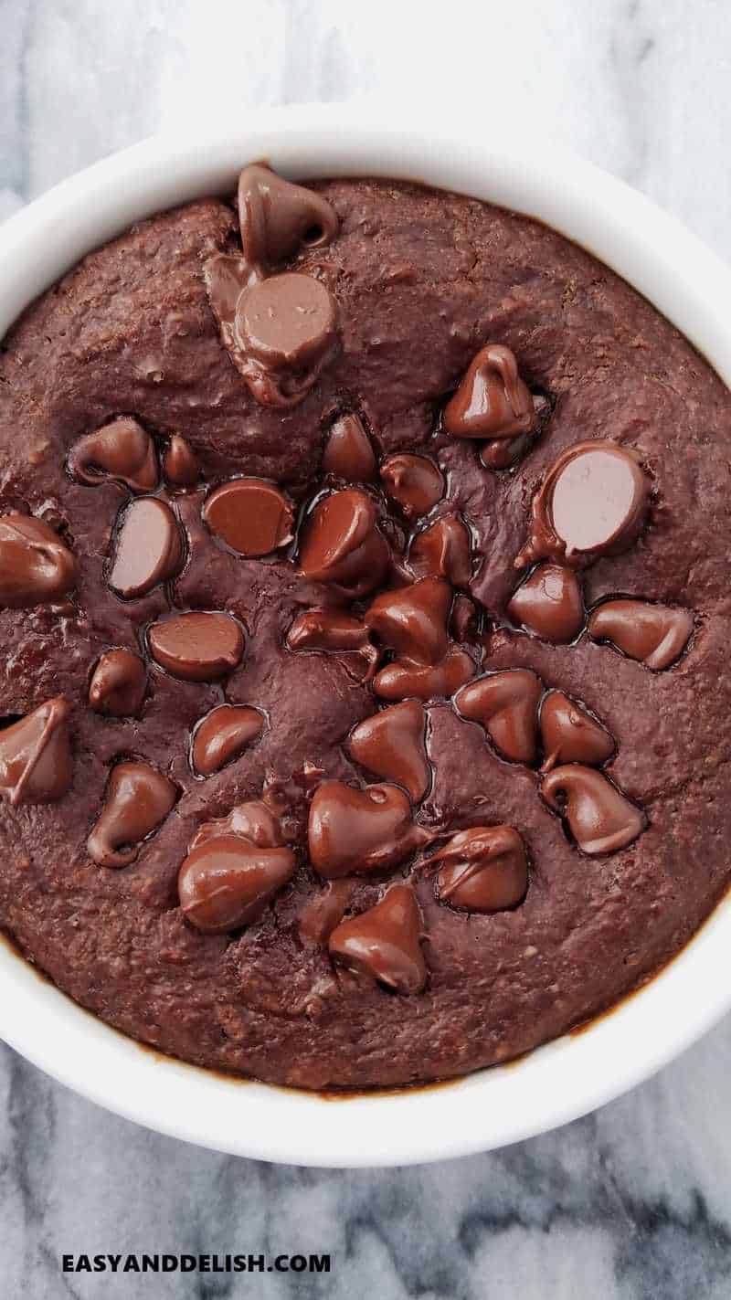 close up of chocolate baked oats with chocolate chips on top