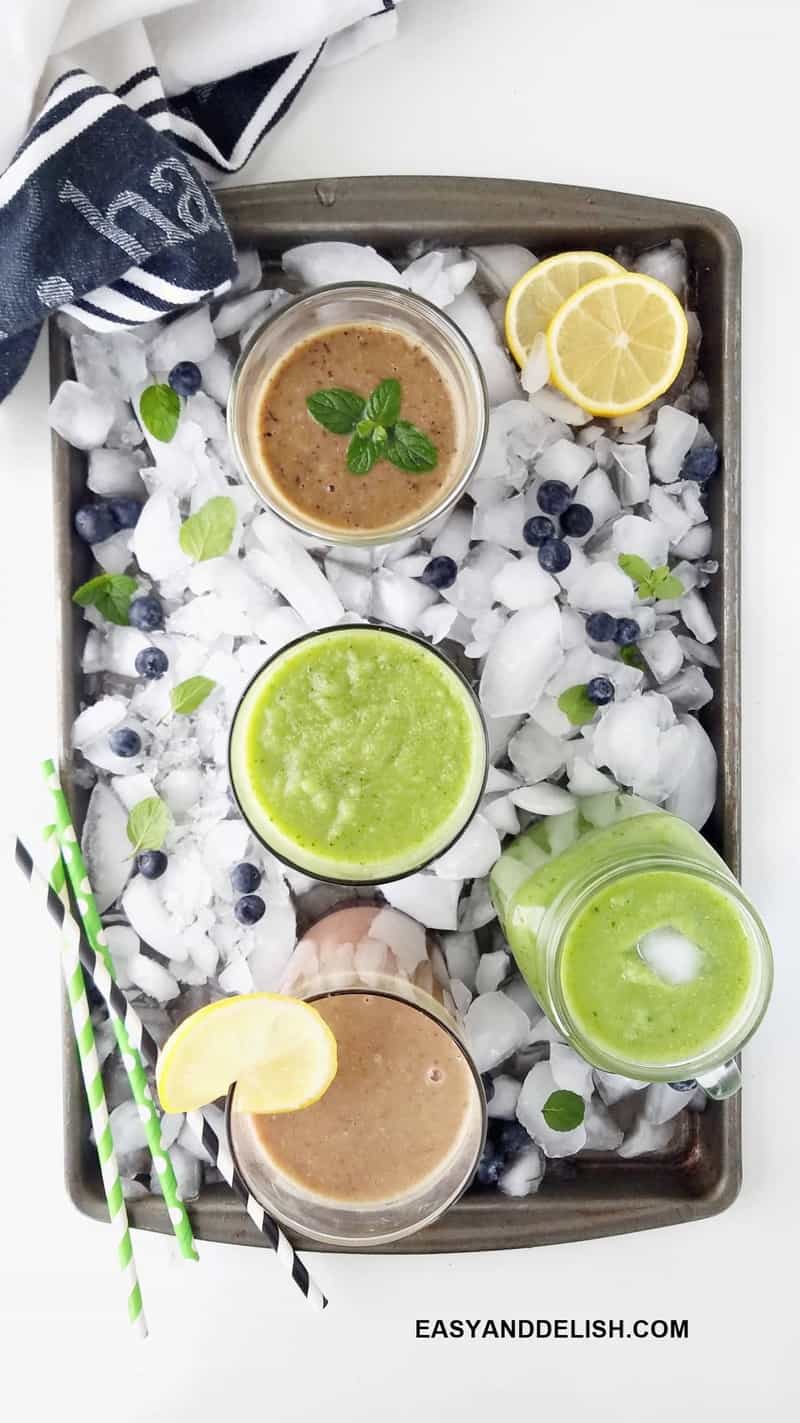 glasses of detox drinks in a tray with ice cubes