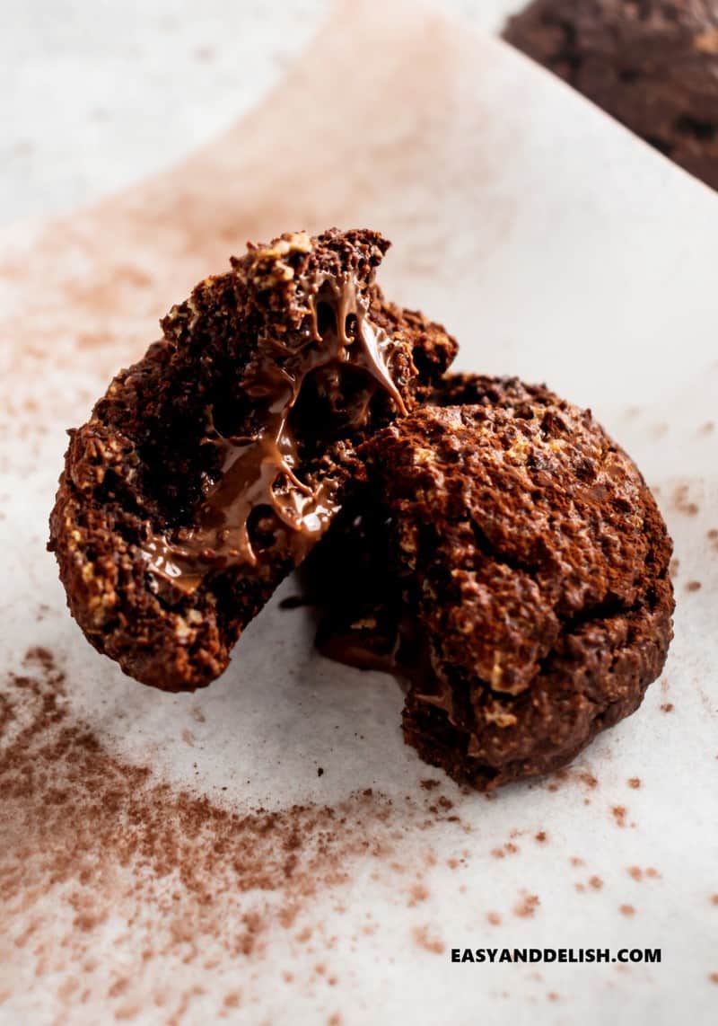 one nutella cookie cut in half showing the creamy center