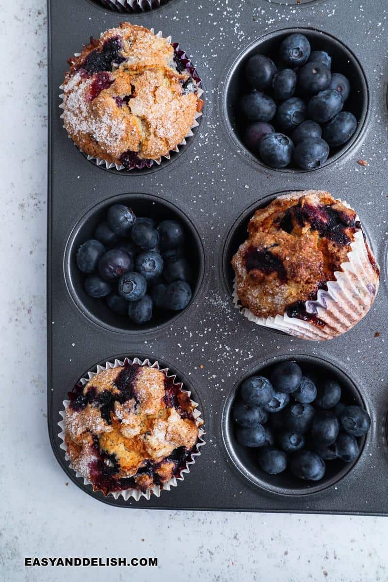 muffin pan with berries and also baked goods in it