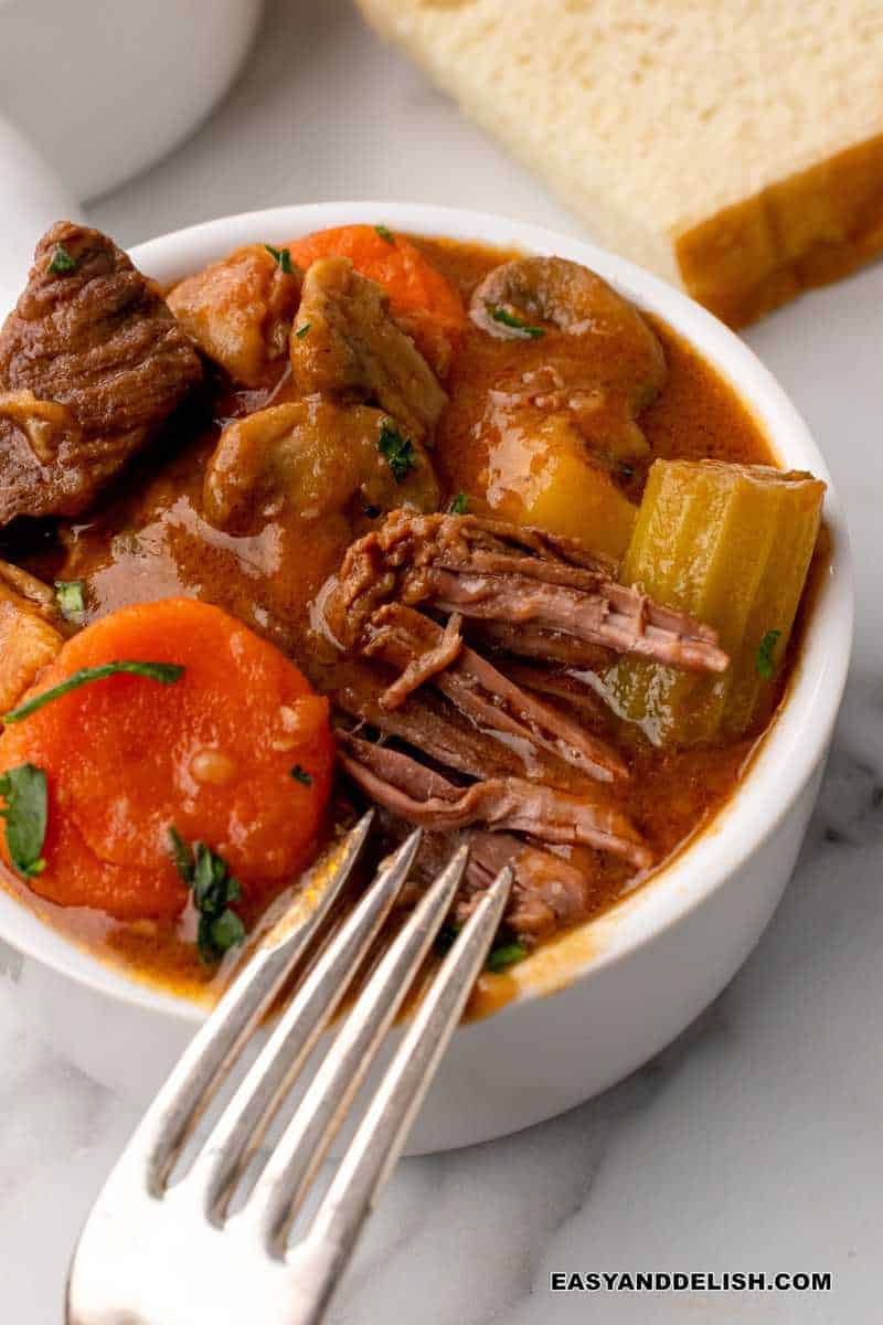 fork close to a bowl of guinness beef stew