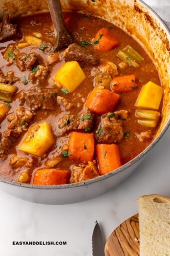 GUINNESS BEEF STEW IN A PAN WITH IRISH SODA BREAD ON THE SIDE