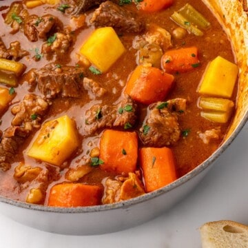 GUINNESS BEEF STEW IN A PAN WITH IRISH SODA BREAD ON THE SIDE