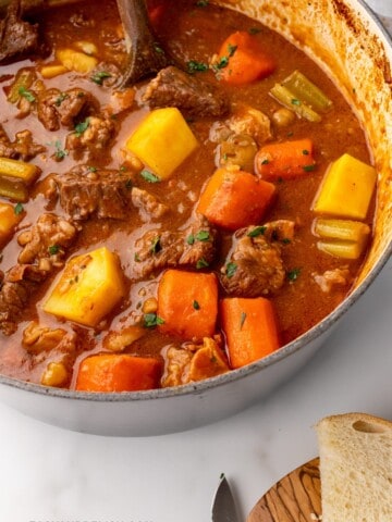 GUINNESS BEEF STEW IN A PAN WITH IRISH SODA BREAD ON THE SIDE