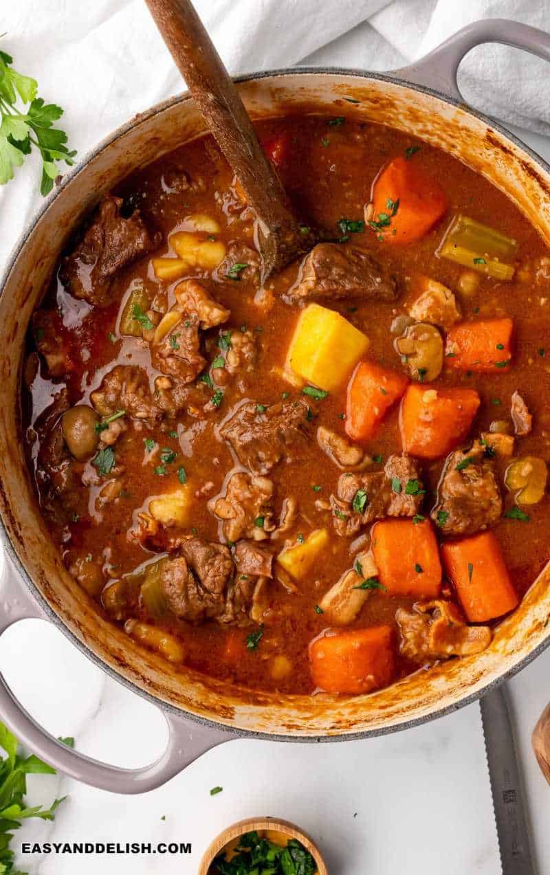 hearty meal in a pan with herbs on the side