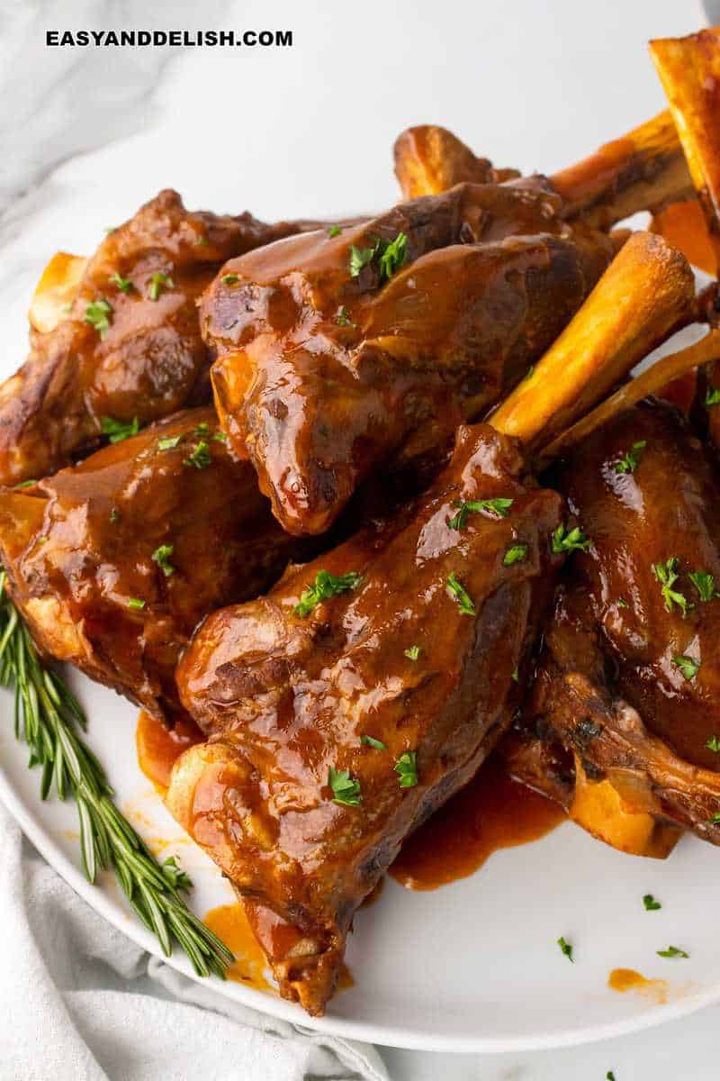 a plate with a bunch of crockpot lamb shanks