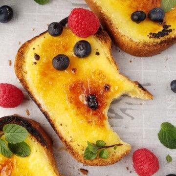 three yogurt toasts in a tray, one was taken a bite