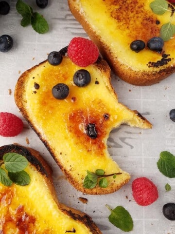 three yogurt toasts in a tray, one was taken a bite