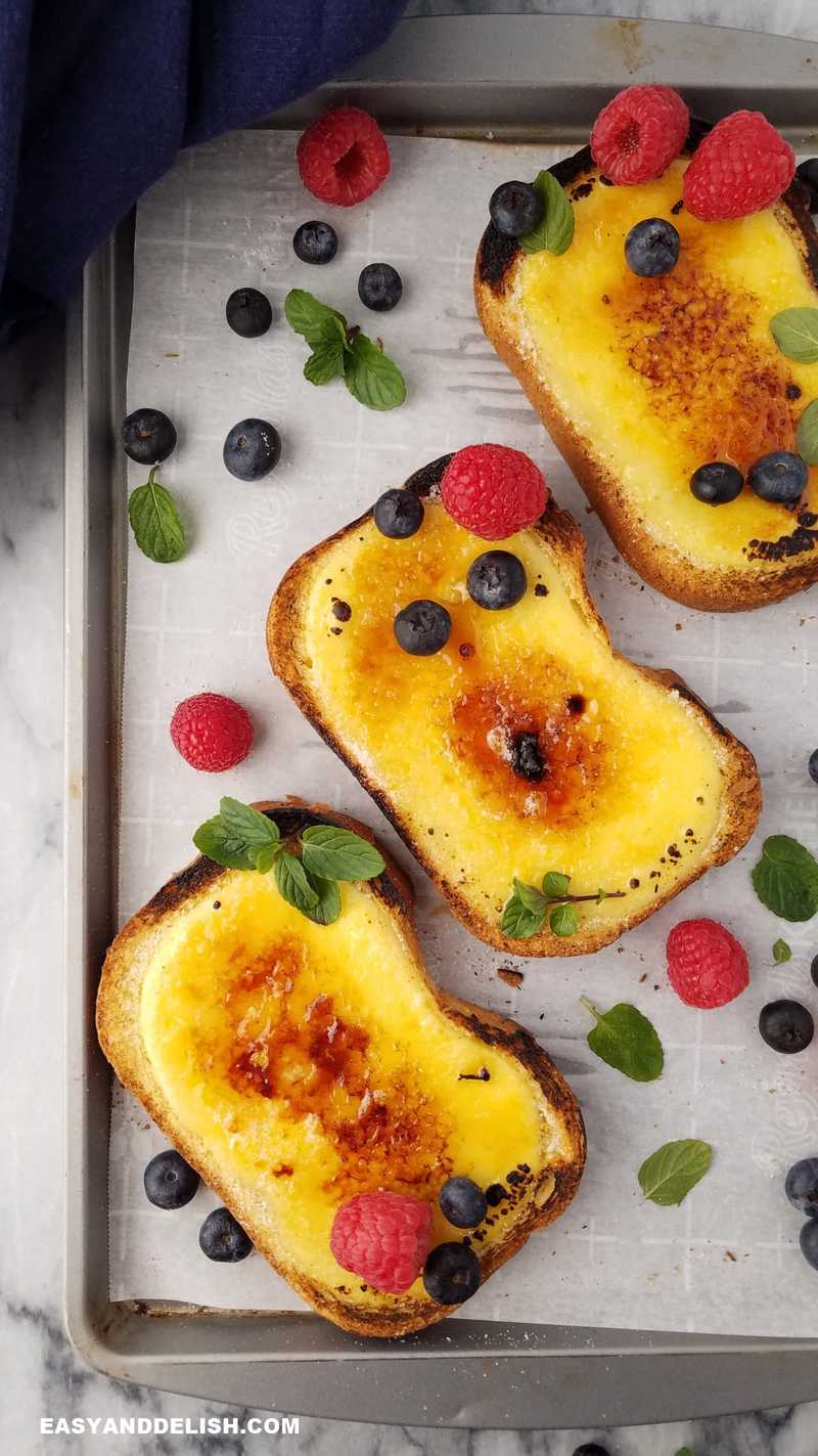 yogurt custard toasts garnished with berries and a napkin on the side