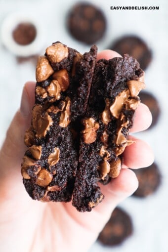 brownie cookies with fudgy centers held in the hand