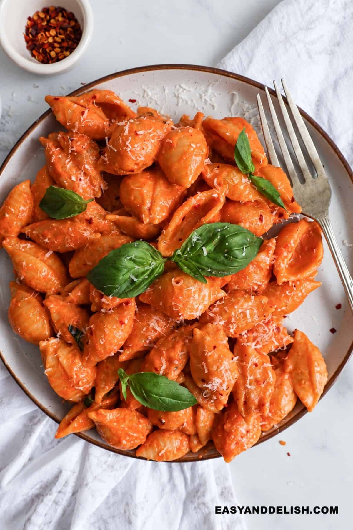 Spicy vodka pasta with Parmesan, basil, and red pepper flakes.