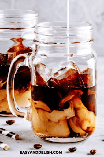 milk poured into a mug with espresso to make iced vanilla latte