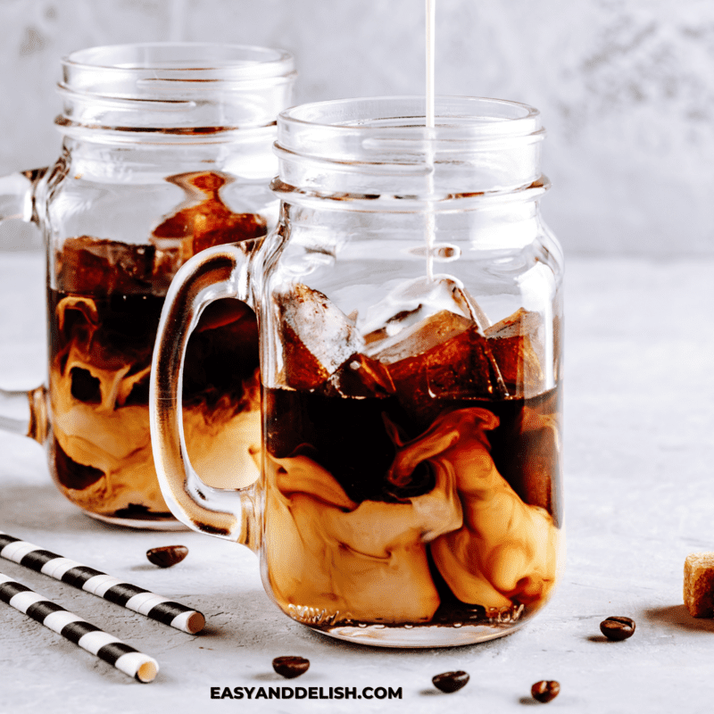 milk poured into a mug with espresso to make iced vanilla latte