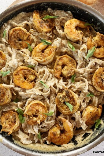 close up of a skillet of creamy cajun shrimp pasta