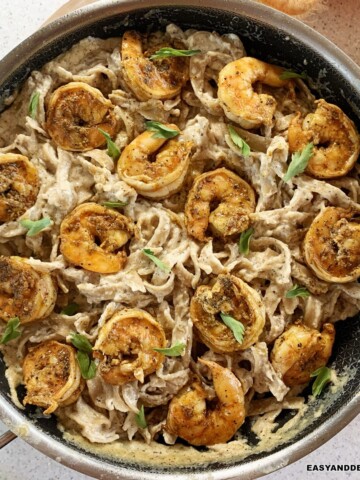 close up of a skillet of creamy cajun shrimp pasta