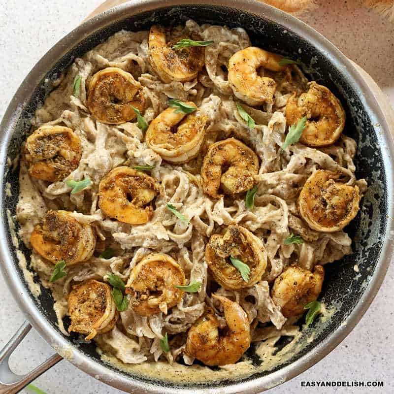 close up of a skillet of creamy cajun shrimp pasta