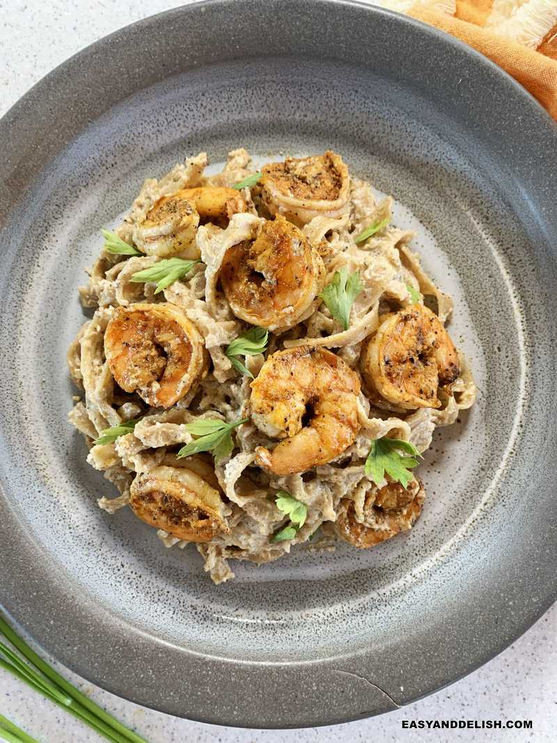 a plate of creamy cajun shrimp pasta